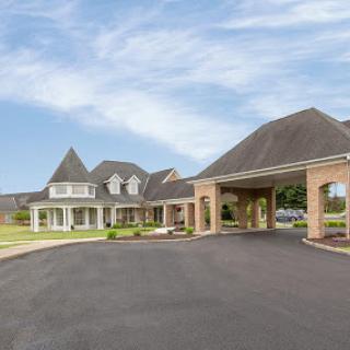 A beautiful residential building with a welcoming entrance and landscaped surroundings.