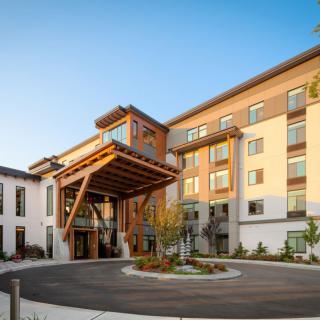 A modern residential building with a welcoming entrance and contemporary architectural design.