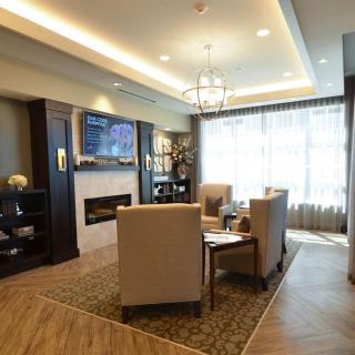 A modern living room with cozy seating and stylish decor.