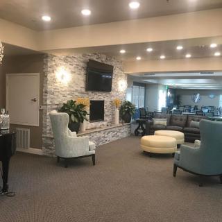 A modern lobby seating area with comfortable furniture and warm lighting.