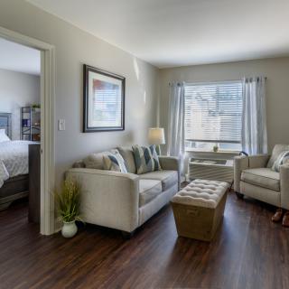 A cozy living room with comfortable seating and natural light.