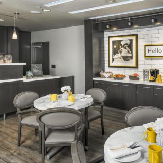 A modern cafe interior featuring a cozy dining area with contemporary decor.