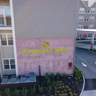 The entrance signage of Kinsland Walk apartment complex.