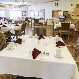 A well-arranged dining room with tables set for guests.