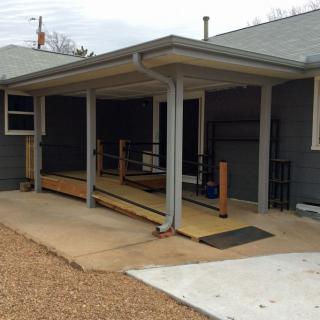 A house with an accessibility ramp on the porch.