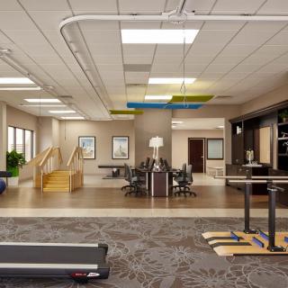 A modern office workspace featuring a treadmill and open design concept.