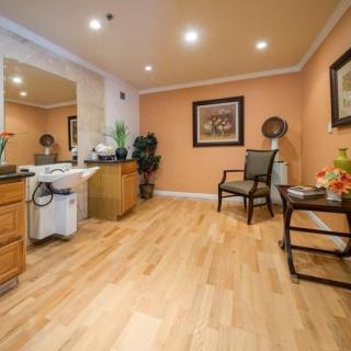 A serene spa room with cozy furnishings and warm lighting.