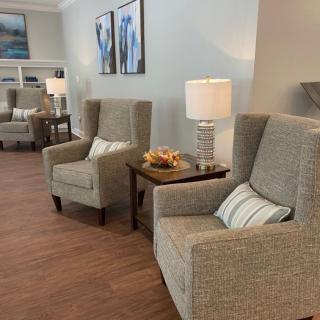 A cozy living room setup with comfortable armchairs and ambient lighting.