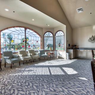 A bright waiting room with comfortable seating and large windows allowing natural light to fill the space.