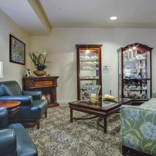 A cozy living room with comfortable seating and elegant decor.