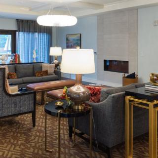 A modern living room interior featuring stylish furniture and elegant lighting.