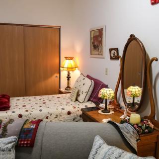 A cozy bedroom with vintage decor and a warm, inviting atmosphere.
