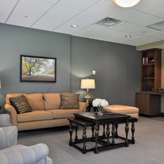 A cozy and modern living room setup featuring a comfortable sofa, stylish coffee table, and decorative artwork.