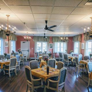 A cozy restaurant dining area with neatly arranged tables and elegant decor.