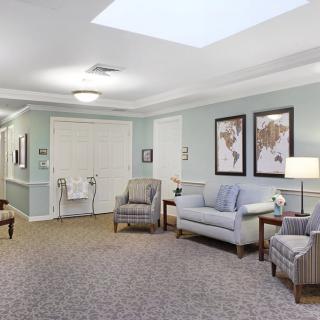 A cozy lounge area with comfortable seating and elegant decor.
