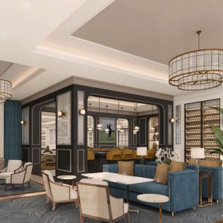 A luxurious lounge area with modern furniture and elegant chandeliers.