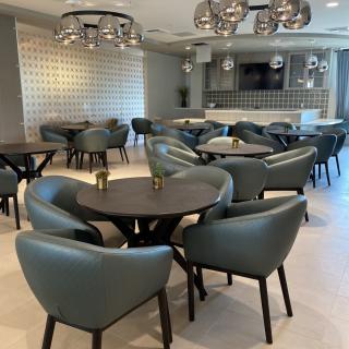 A modern dining area with stylish furniture and contemporary lighting.