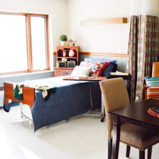 A cozy and well-decorated bedroom with a comfortable bed and ample natural light.