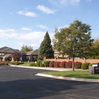 A suburban residential area featuring well-maintained landscaping and a quiet road.