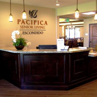 The reception area of Pacifica Senior Living Escondido, featuring a welcoming lobby design.