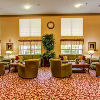 A cozy lobby area featuring comfortable seating and warm decor.