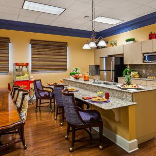 Modern kitchen and dining area with stylish furniture and decor.