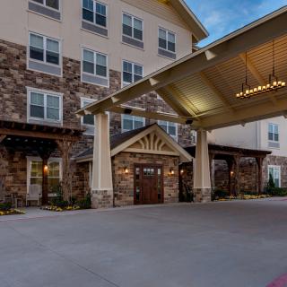 A beautifully lit hotel entrance during the evening.