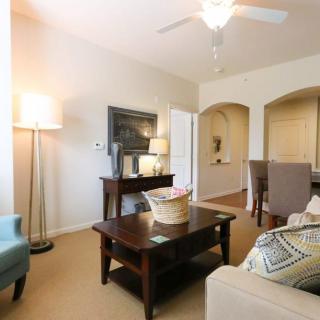 A cozy living room with classic furniture and warm lighting.