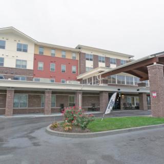 A modern hotel building with a welcoming entrance and multi-story design.
