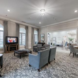 A spacious living room with elegant furnishings and a cozy atmosphere.