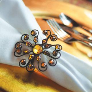 Elegant table setting with a decorative napkin ring.