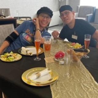 Two people enjoying a meal at a restaurant table.