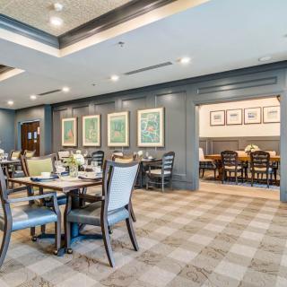 Elegant dining space with well-arranged tables and comfortable seating.
