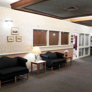 A cozy lobby area with seating and decorative lighting.