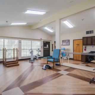 A spacious rehabilitation facility equipped with exercise and therapy equipment.