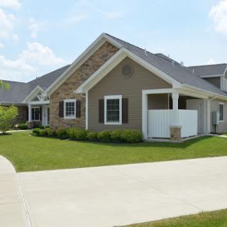 A beautiful suburban home with a well-maintained lawn and inviting architecture.