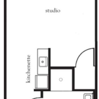 A floor plan of a studio apartment featuring a kitchenette and bathroom layout.