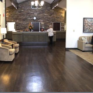 A welcoming hotel lobby featuring a reception desk and comfortable seating.
