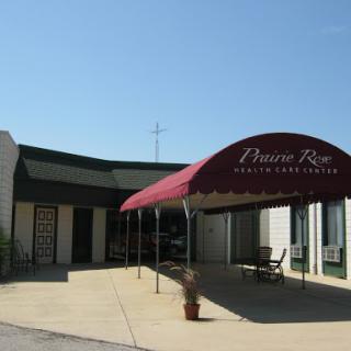 Entrance of a commercial building with an awning on a clear day.