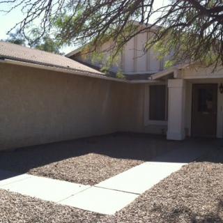 A suburban house with a simple front yard.