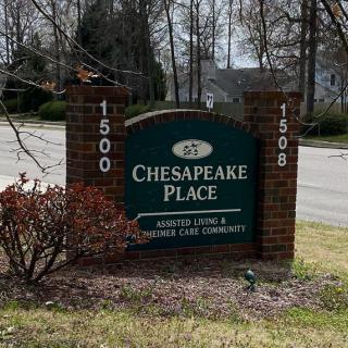 A roadside sign for Chesapeake Place, indicating an assisted living community.