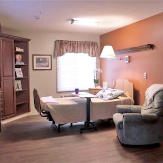 A cozy indoor room featuring a comfortable seating area, suitable for relaxation and reading.