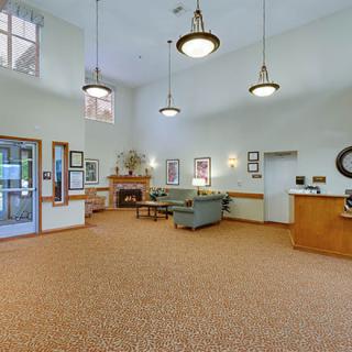 Spacious lobby area with comfortable seating and elegant lighting.