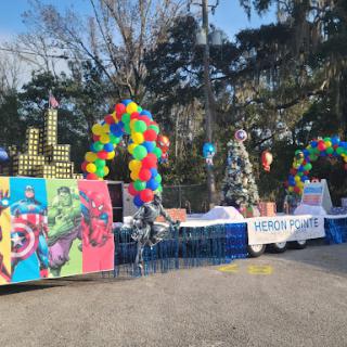 A vibrant setup for a superhero-themed event, complete with colorful balloons and festive decorations.