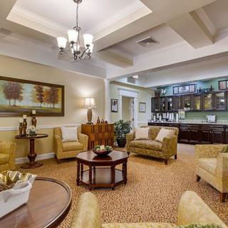 A cozy and elegantly designed living room with comfortable seating and warm lighting.