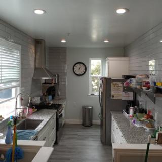A modern kitchen with stainless steel appliances and a tidy countertop.
