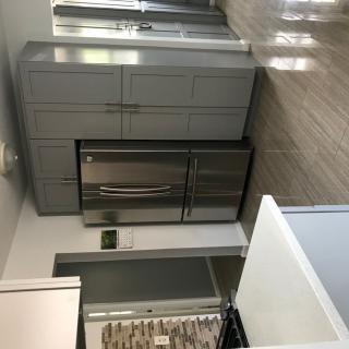 A modern kitchen featuring stainless steel appliances and sleek cabinetry.