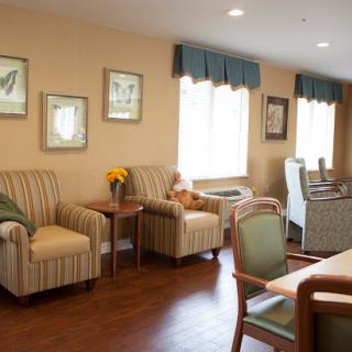 A cozy and inviting lounge area with comfortable seating and warm decor.