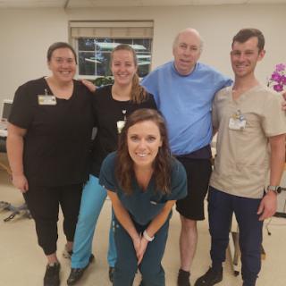 A dedicated healthcare team posing for a group photo.