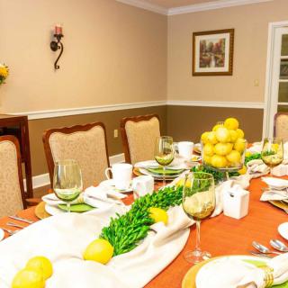 A beautifully set dining table adorned with lemons and elegant tableware.